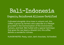 Load image into Gallery viewer, Cultivated alongside citrus trees in volcanic soil by small, family-owned farms, this coffee is grown by farmers who subscribe to a lifestyle and philosophy grounded in the harmonization of environment, humans and God. Wet hulled with a special technique that gives the raw beans a blueish tint; this coffee delivers a wonderful richness and a subtle play of flavor notes on the palate.